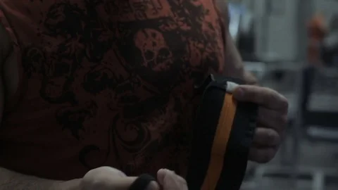 Muscular bodybuilder guy doing exercises in gym.Man working with weights in gym Stock Footage 70076484