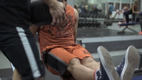Muscular bodybuilder guy doing exercises in gym.Man working with weights in gym Stock Footage 70076832