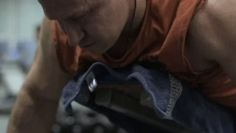 Muscular bodybuilder guy doing exercises in gym.Man working with weights in gym Stock Footage 70077032