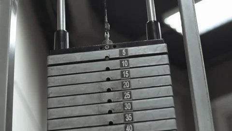 Muscular bodybuilder guy doing exercises in gym.Man working with weights in gym Stock Footage 70077045