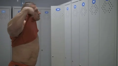 Muscular bodybuilder guy doing exercises in gym.Man working with weights in gym Stock Footage 70077466