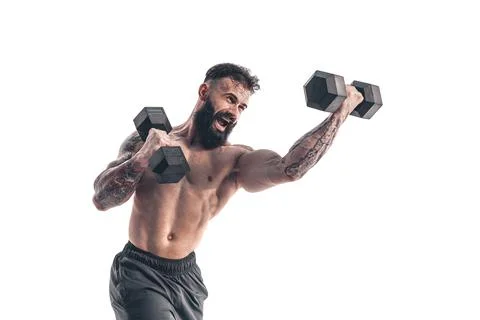 Muscular bodybuilder guy doing exercises with dumbbell over whit Fotos de archivo