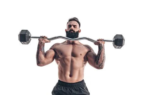 Muscular bodybuilder guy doing exercises with dumbbell over whit Stock Photos