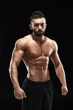 Muscular bodybuilder guy doing posing Stock Photos