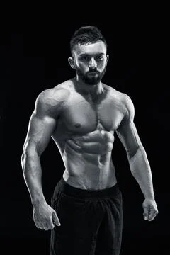 Muscular bodybuilder guy doing posing Stock Photos
