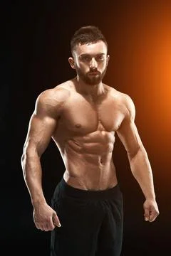 Muscular bodybuilder guy doing posing Stock Photos