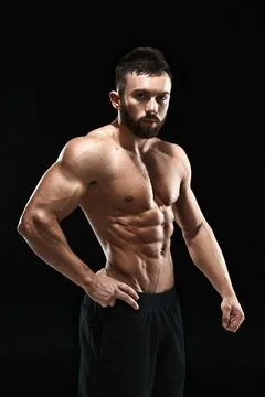 Muscular bodybuilder guy doing posing Stock Photos
