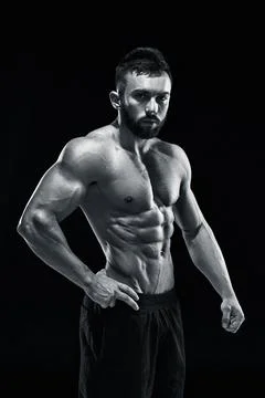 Muscular bodybuilder guy doing posing Stock Photos