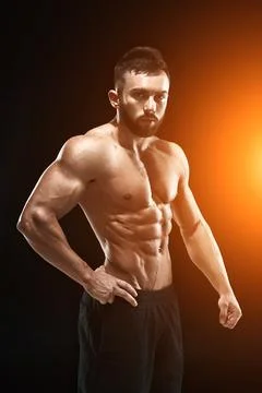 Muscular bodybuilder guy doing posing Stock Photos