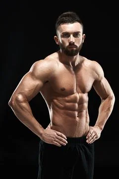 Muscular bodybuilder guy doing posing Stock Photos
