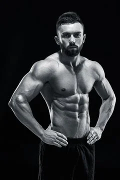 Muscular bodybuilder guy doing posing Stock Photos
