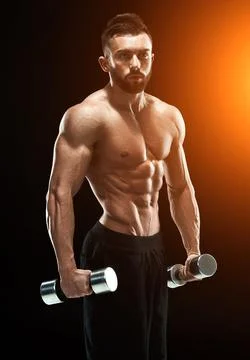 Muscular bodybuilder guy doing posing Stock Photos