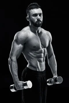 Muscular bodybuilder guy doing posing Stock Photos