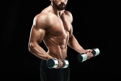 Muscular bodybuilder guy doing posing Stock Photos