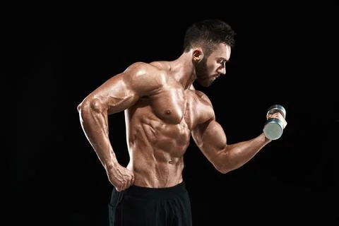 Muscular bodybuilder guy doing posing Stock Photos