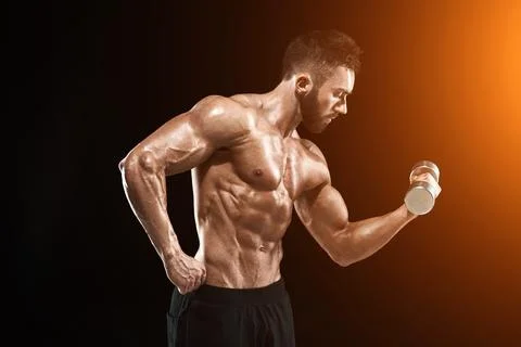 Muscular bodybuilder guy doing posing Stock Photos