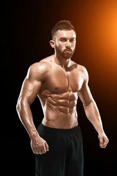 Muscular bodybuilder guy doing posing Stock Photos