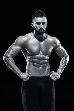 Muscular bodybuilder guy doing posing Stock Photos
