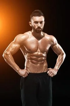 Muscular bodybuilder guy doing posing Stock Photos
