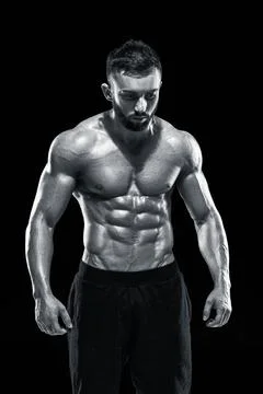 Muscular bodybuilder guy doing posing Stock Photos