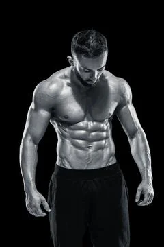 Muscular bodybuilder guy doing posing Stock Photos