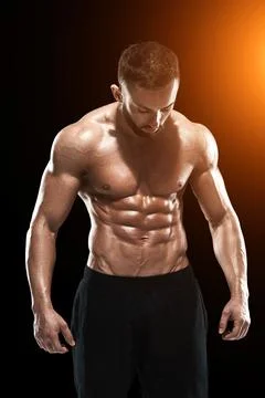 Muscular bodybuilder guy doing posing Stock Photos