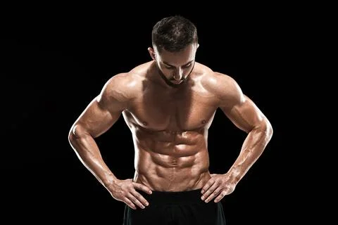 Muscular bodybuilder guy doing posing Stock Photos