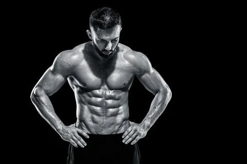 Muscular bodybuilder guy doing posing Stock Photos