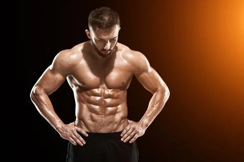 Muscular bodybuilder guy doing posing Stock Photos