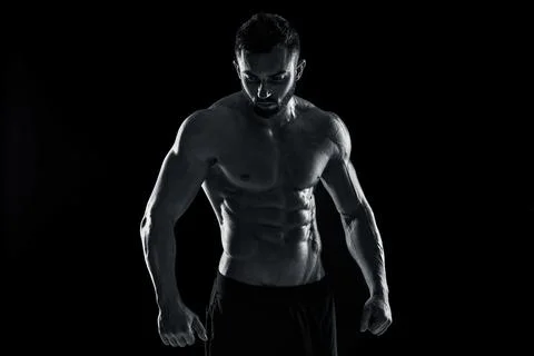 Muscular bodybuilder guy doing posing Stock Photos