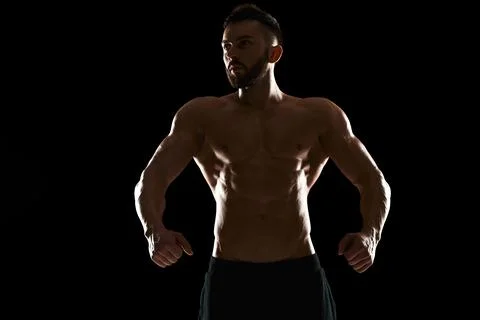 Muscular bodybuilder guy doing posing Stock-Fotos