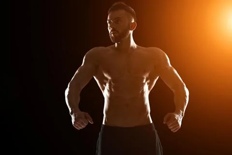 Muscular bodybuilder guy doing posing Stock Photos