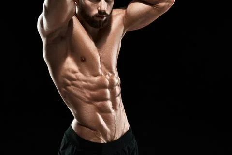Muscular bodybuilder guy doing posing Stock Photos