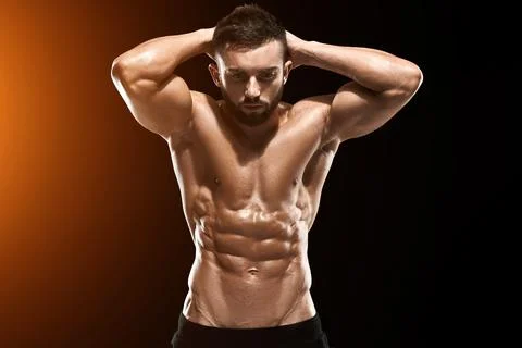 Muscular bodybuilder guy doing posing Stock Photos