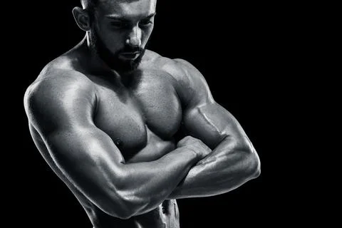 Muscular bodybuilder guy doing posing Stock Photos