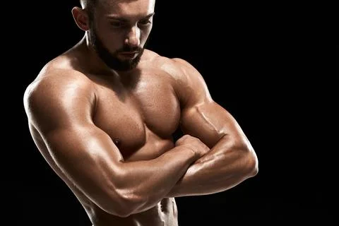 Muscular bodybuilder guy doing posing Stock Photos