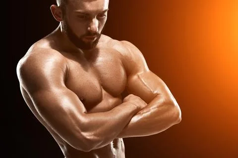 Muscular bodybuilder guy doing posing Stock Photos