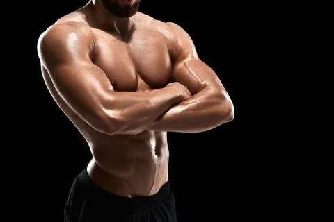 Muscular bodybuilder guy doing posing Stock Photos