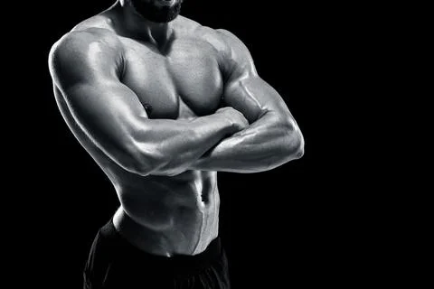 Muscular bodybuilder guy doing posing Stock Photos