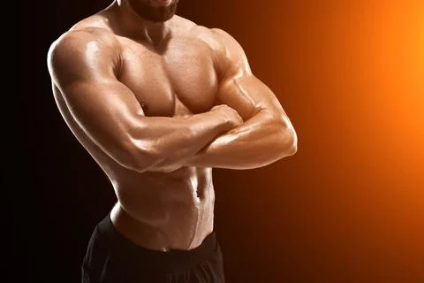 Muscular bodybuilder guy doing posing Stock Photos