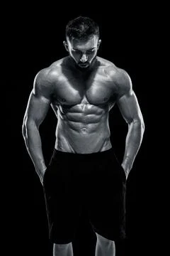 Muscular bodybuilder guy doing posing Stock Photos