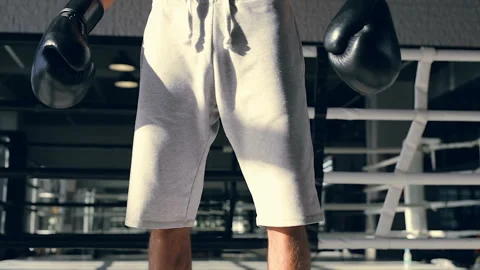 Muscular boxer stading at the ring without movement. Looking straight a head. Stock Footage 98678673