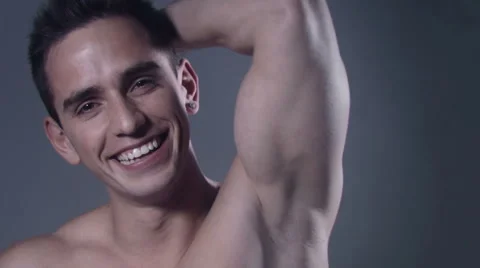 Muscular cheerful man posing in studio. 動画素材 58144581