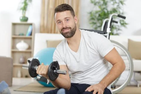 Muscular disabled man using weights Stock Photos