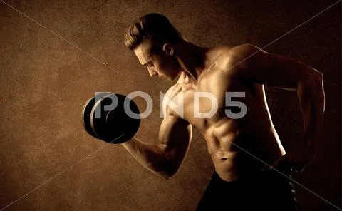 Muscular fit bodybuilder athlete lifting weight Stock Photos