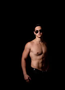 Muscular guy on a black background. studio photo Stock Photos