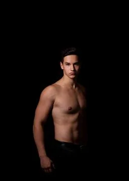 Muscular guy on a black background. studio photo Stock Photos