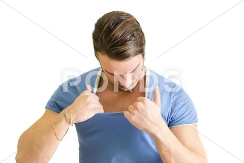 Muscular guy checking out his chest muscles Stock Photos