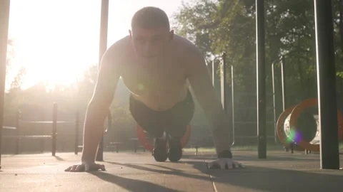 Muscular Guy Performing Push-Ups Outside, Embracing Active Outdoor Fitness Видео 331252376
