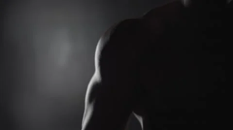 Muscular man on a black background Stock Footage 63068951
